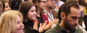 Person clapping at event